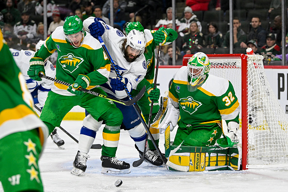 ST. PAUL, MN - JANUARY 04: Minnesota Wild Defenceman Jon Merrill (4) and Tampa Bay Lightning Left Wing Pat Maroon (14) battle for a loose puck in front of Minnesota Wild Goalie Filip Gustavsson (32) during the second period of a game between the Minnesota Wild and Tampa Bay Lightning on January 4, 2023, at Xcel Energy Center in St. Paul, MN.(Photo by Nick Wosika/Icon Sportswire via Getty Images)