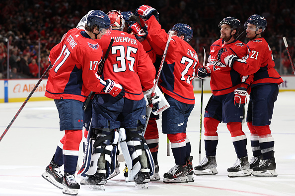WASHINGTON, DC - JANUARY 26: The Washington Capitals celebrate after defeating the Pittsburgh Penguins during a shootout at Capital One Arena on January 26, 2023 in Washington, DC. (Photo by Patrick Smith/Getty Images)