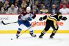 PITTSBURGH, PENNSYLVANIA - APRIL 05: Nathan MacKinnon #29 of the Colorado Avalanche controls the puck past Bryan Rust #17 of the Pittsburgh Penguins during the second period at PPG PAINTS Arena on April 05, 2022 in Pittsburgh, Pennsylvania. (Photo by Emilee Chinn/NHL Getty Images)