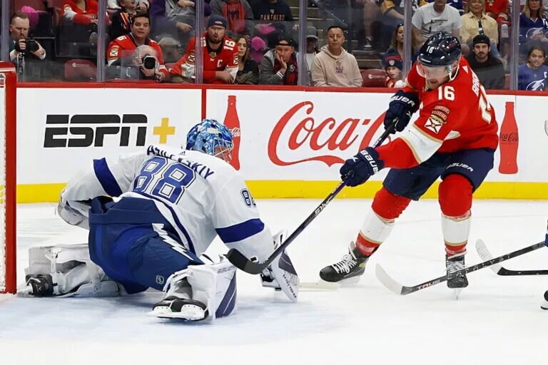 SUNRISE, FL - OCTOBER 21: Goaltender Andrei Vasilevskiy #88 of the Tampa Bay Lightning defends the net against the shot by Aleksander Barkov #16 of the Florida Panthers at the FLA Live Arena during an NHL game on October 21, 2022 in Sunrise, Florida. (Photo by Joel Auerbach/NHL Getty Images)