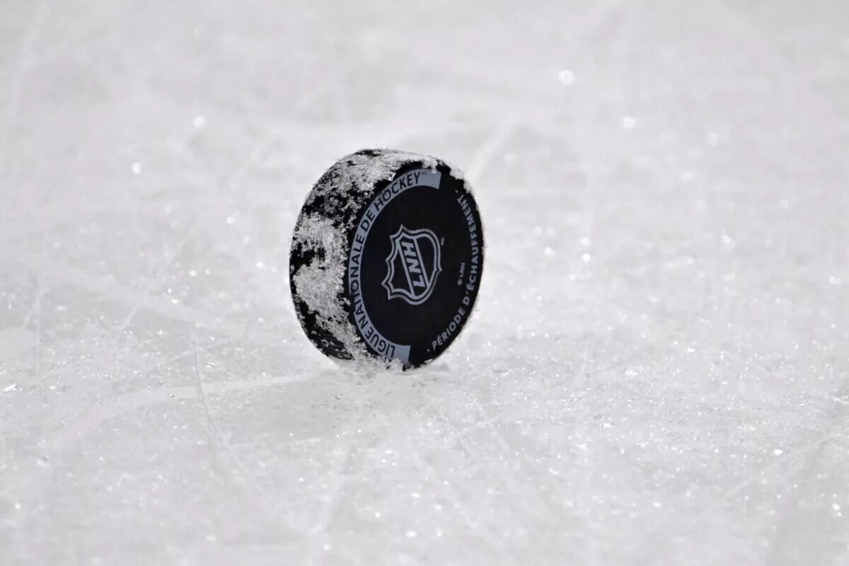 Stream and watch NHL hockey logo on puck