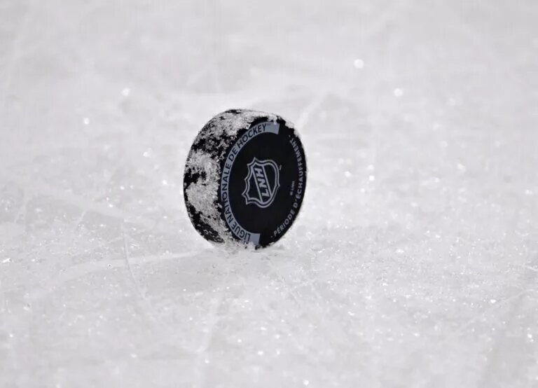 Stream and watch NHL hockey logo on puck