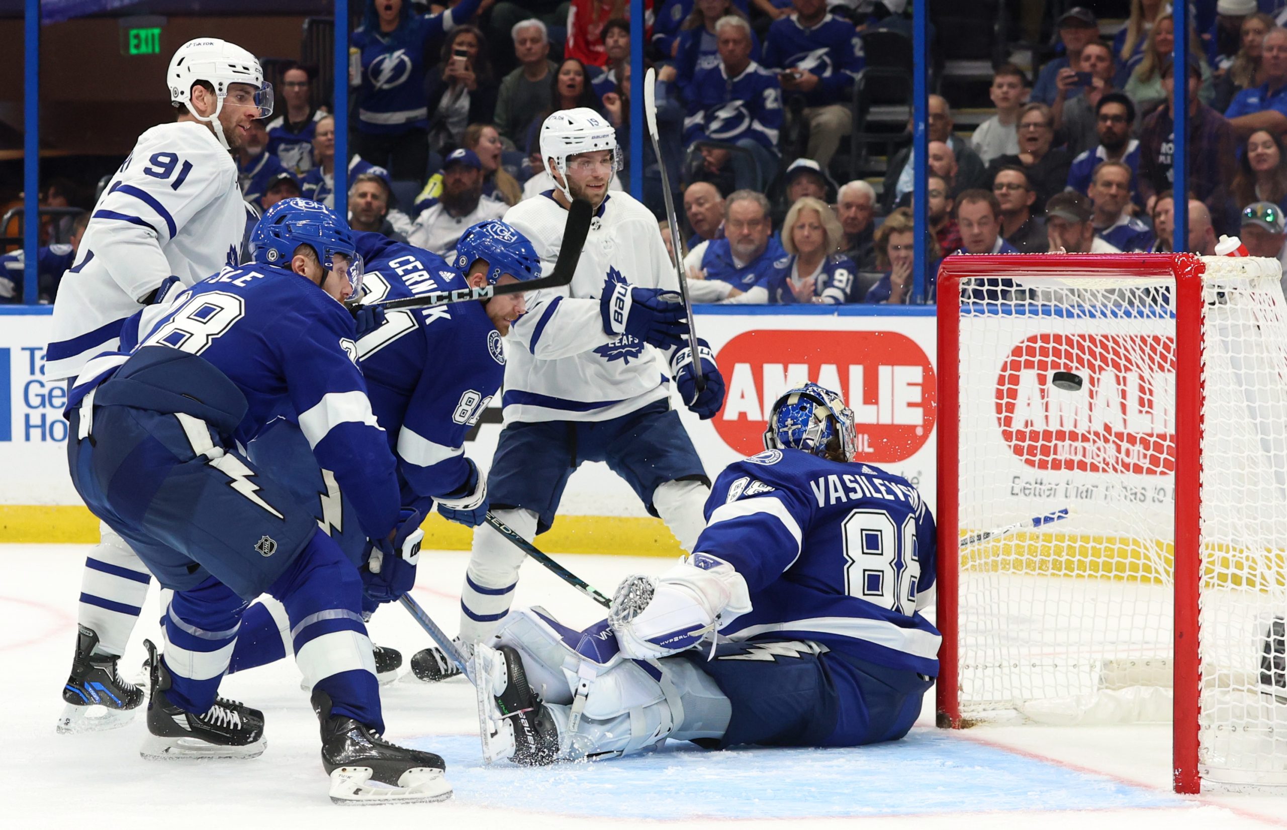 Tampa Bay Lightning vs Toronto Maple Leafs sees a puck near the net