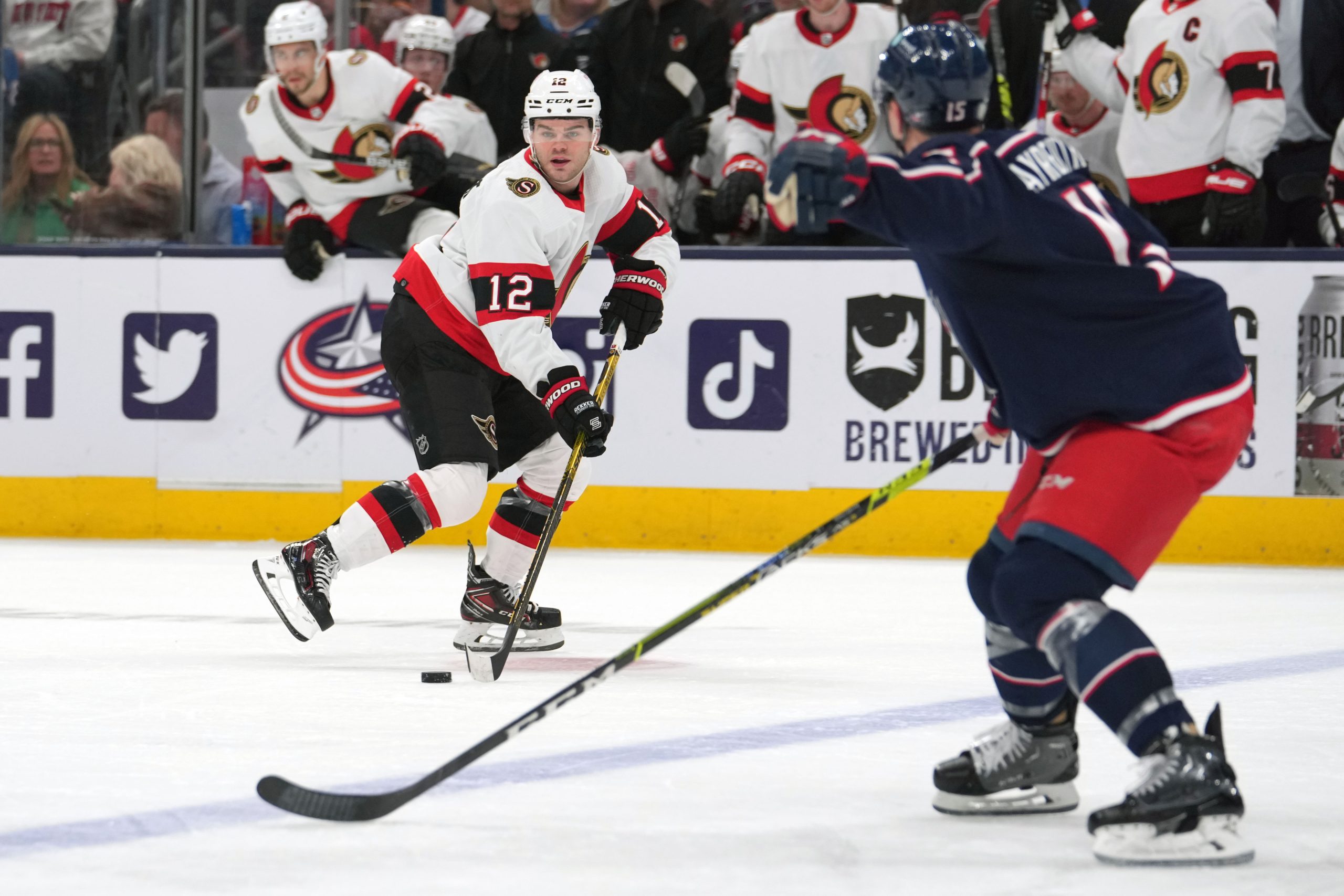 Apr 2, 2023; Columbus, Ohio, USA; Ottawa Senators right wing Alex DeBrincat (12) skates with the puck during the second period against the Columbus Blue Jackets at Nationwide Arena. Mandatory Credit: Jason Mowry-USA TODAY Sports