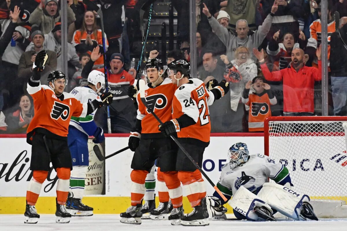 Christian Dvorak (22) celebrates his goal against Vancouver Canucks goaltender Thatcher Demko