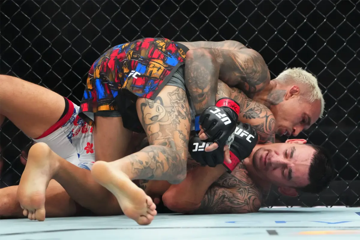 Charles Oliveira and Max Holloway at UFC 326