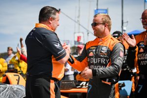 2023 IndyCar Grid - McLaren's Zak Brown and Felix Rosenqvist shake hands before the 2022 Firestone Grand Prix of Monterey