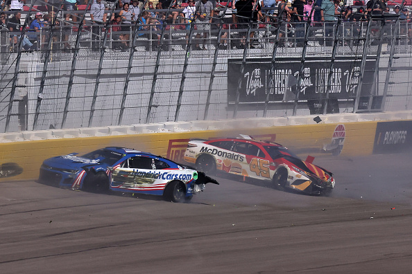 LAS VEGAS, NEVADA - OCTOBER 16: Kyle Larson, driver of the #5 HendrickCars.com Chevrolet, and Bubba Wallace, driver of the #45 McDonald's Toyota, spin after an on-track incident during the NASCAR Cup Series South Point 400 at Las Vegas Motor Speedway on October 16, 2022 in Las Vegas, Nevada. (Photo by Jonathan Bachman/Getty Images)