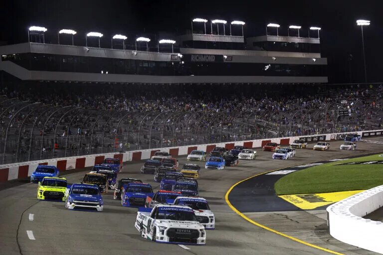 RICHMOND, VIRGINIA - AUGUST 13: Chandler Smith, driver of the #18 Charge Me Toyota, leads the field during the NASCAR Camping World Truck Series Worldwide Express 250 for Carrier Appreciation at Richmond Raceway on August 13, 2022 in Richmond, Virginia. (Photo by Jared C. Tilton/Getty Images)