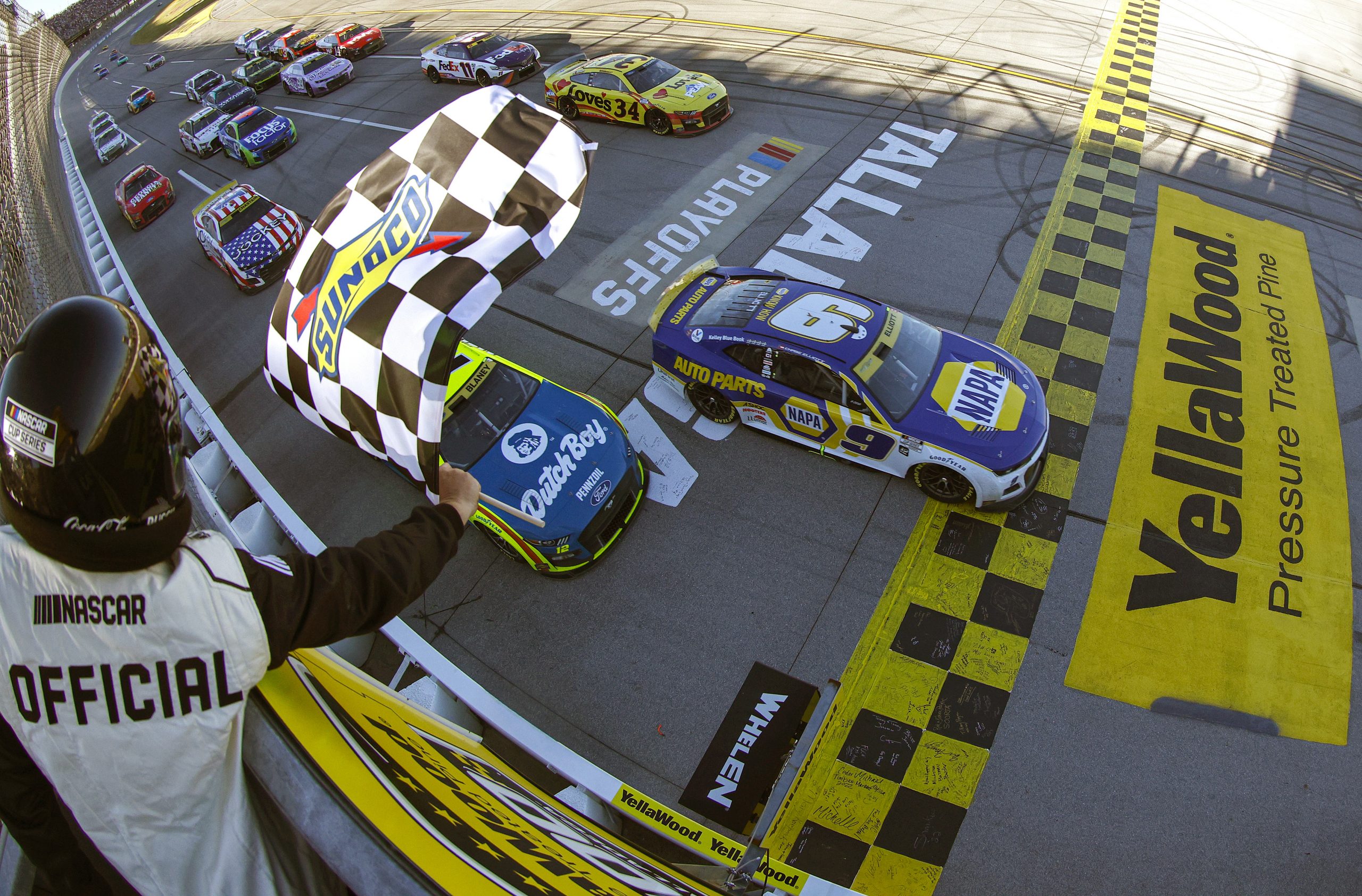 Chase Elliott crosses the finish line to win the 2022 YellaWood 500 at Talladega Superspeedway
