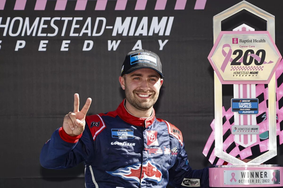 Ty Majeski poses with the trophy after his victory in the 2022 Baptist Health 200 at Homestead-Miami Speedway