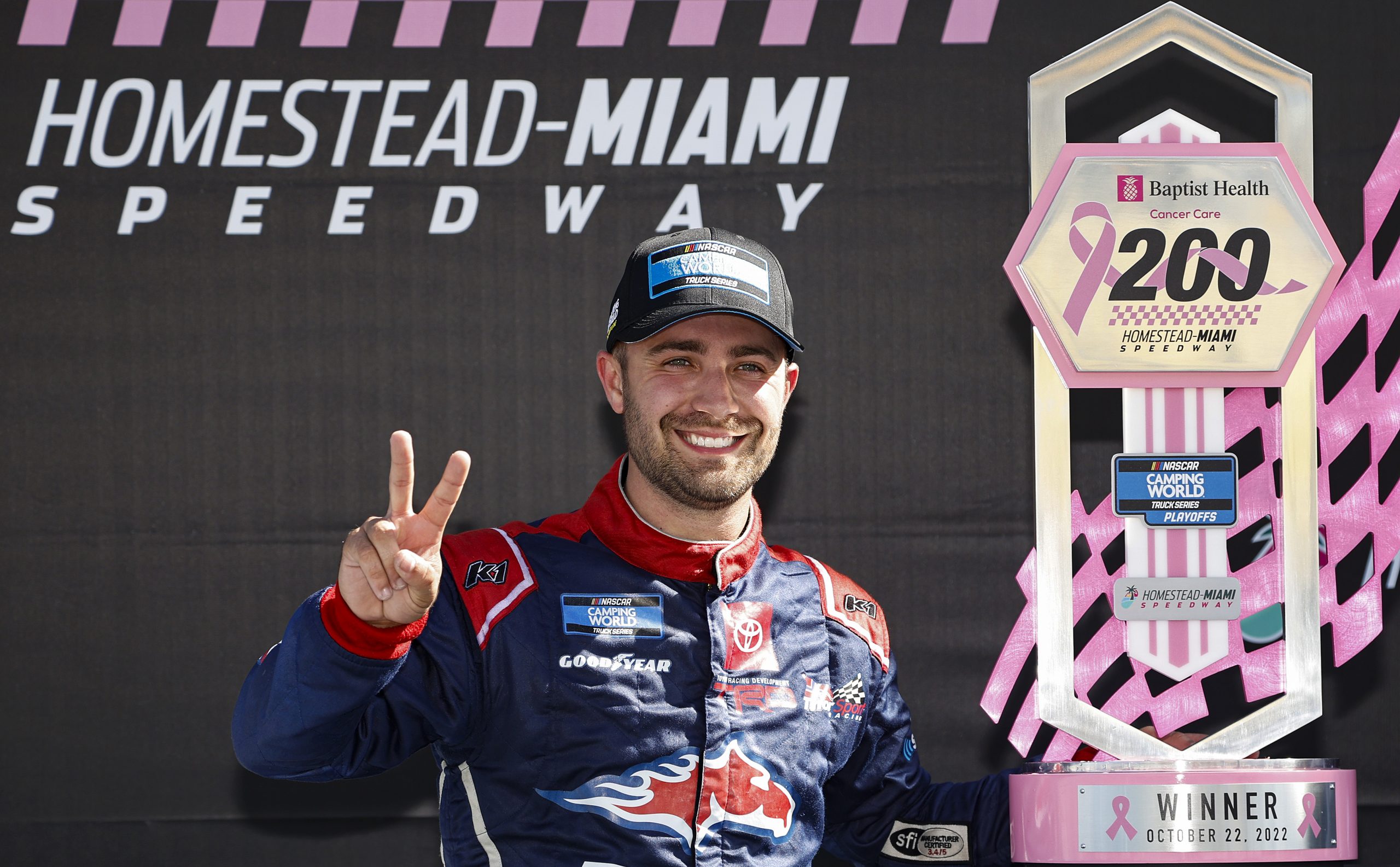 Ty Majeski poses with the trophy after his victory in the 2022 Baptist Health 200 at Homestead-Miami Speedway