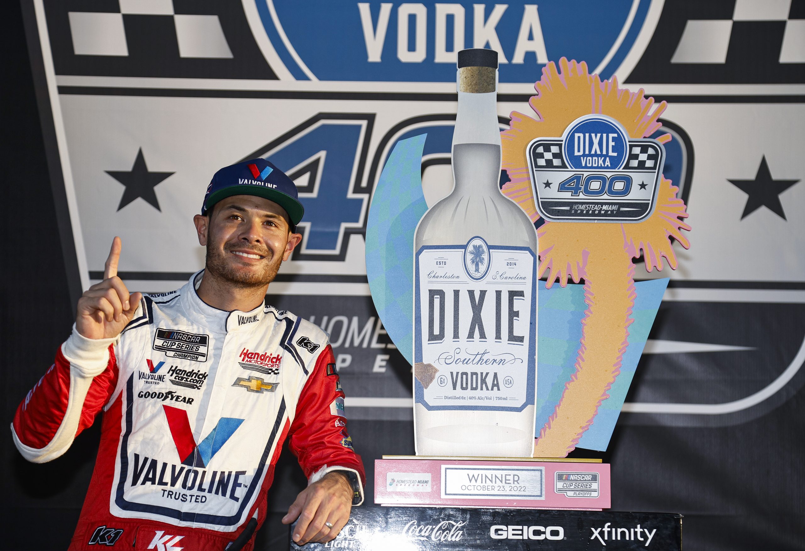 Kyle Larson poses with the trophy after winning the 2022 Dixie Vodka 400 at Homestead-Miami Speedway