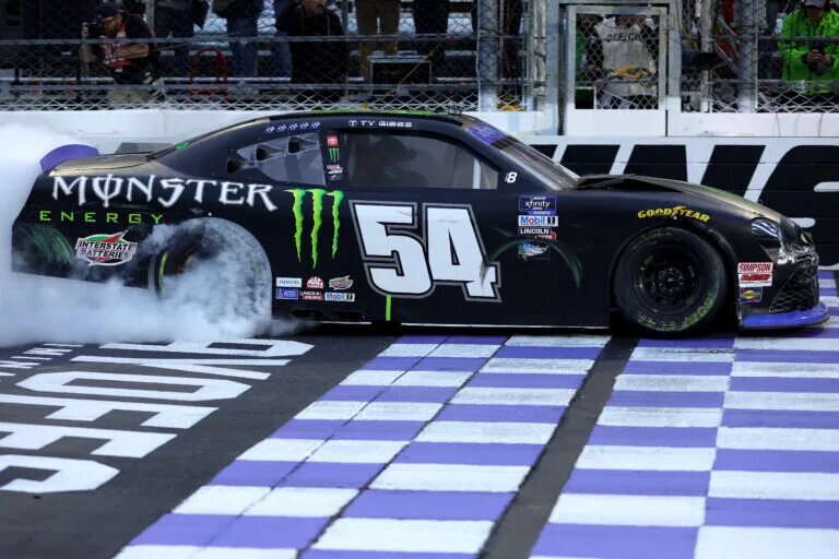 MARTINSVILLE, VIRGINIA - OCTOBER 29: Ty Gibbs, driver of the #54 Monster Energy Toyota, celebrates with a burnout after winning the NASCAR Xfinity Series Dead On Tools 250 at Martinsville Speedway on October 29, 2022 in Martinsville, Virginia. (Photo by Stacy Revere/Getty Images)