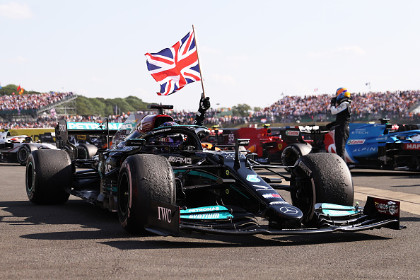 NORTHAMPTON, ENGLAND - JULY 18: Race winner Lewis Hamilton of Great Britain and Mercedes GP celebrates in parc ferme during the F1 Grand Prix of Great Britain at Silverstone on July 18, 2021 in Northampton, England. (Photo by Lars Baron/Getty Images)