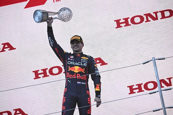 Red Bull Racing's Dutch driver Max Verstappen poses on the podium with the trophy following his victory at the Formula One Japanese Grand Prix at Suzuka, Mie prefecture on October 9, 2022. (Photo by Philip FONG / AFP) (Photo by PHILIP FONG/AFP via Getty Images)
