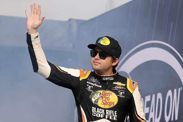 MARTINSVILLE, VIRGINIA - OCTOBER 29: Noah Gragson, driver of the #9 Bass Pro Shops/TrueTimber/BRCC Chevrolet, waves to fans as he walks onstage during driver intros prior to the NASCAR Xfinity Series Dead On Tools 250 at Martinsville Speedway on October 29, 2022 in Martinsville, Virginia. (Photo by Stacy Revere/Getty Images)