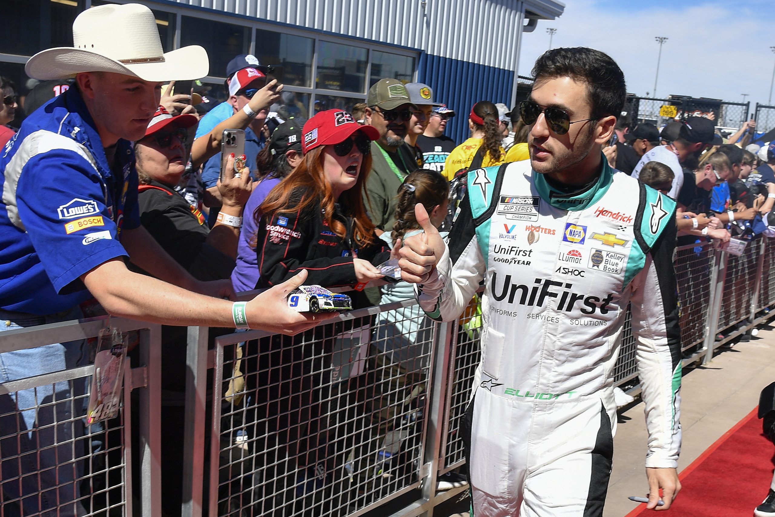 AVONDALE, ARIZONA - MARCH 13: Chase Elliott, driver of the #9 UniFirst Chevrolet, gives a thumbs up to fans during the red carpet prior to the Ruoff Mortgage 500 during at Phoenix Raceway on March 13, 2022 in Avondale, Arizona. (Photo by Logan Riely/Getty Images)
