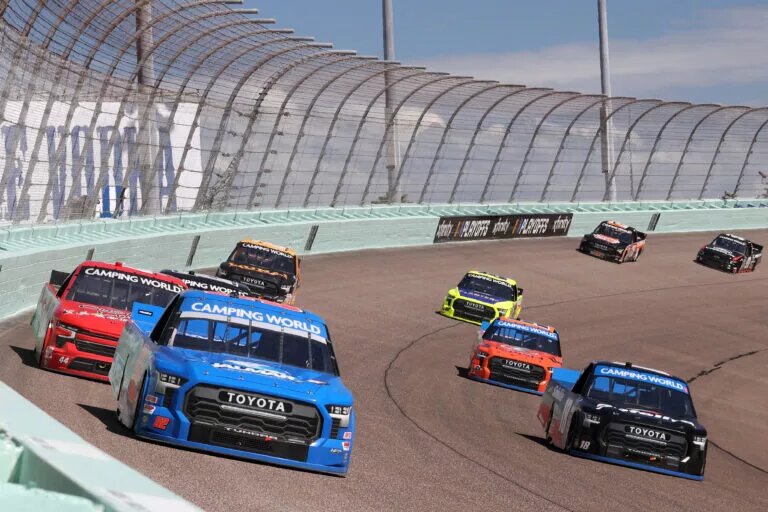 HOMESTEAD, FLORIDA - OCTOBER 22: Stewart Friesen, driver of the #52 Halmar International Toyota, and Chandler Smith, driver of the #18 Safelite AutoGlass Toyota, race during the NASCAR Camping World Truck Series Baptist Health 200 at Homestead-Miami Speedway on October 22, 2022 in Homestead, Florida. (Photo by Jared East/Getty Images)