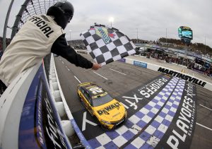 MARTINSVILLE, VIRGINIA - OCTOBER 30: Christopher Bell, driver of the #20 DeWalt Toyota, takes the checkered flag to win the NASCAR Cup Series Xfinity 500 at Martinsville Speedway on October 30, 2022 in Martinsville, Virginia. (Photo by Mike Mulholland/Getty Images)