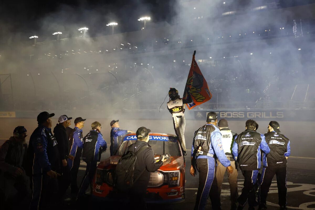 AVONDALE, ARIZONA - NOVEMBER 04: Zane Smith, driver of the #38 Michael Roberts Construction Ford, and crew celebrate after winning the 2022 NASCAR Camping World Truck Series Championship and the NASCAR Camping World Truck Series Lucas Oil 150 at Phoenix Raceway on November 04, 2022 in Avondale, Arizona. (Photo by Jared C. Tilton/Getty Images)