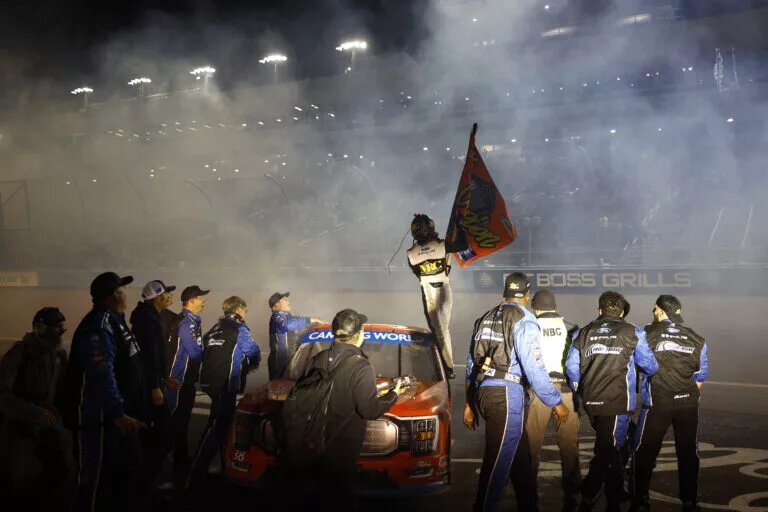 AVONDALE, ARIZONA - NOVEMBER 04: Zane Smith, driver of the #38 Michael Roberts Construction Ford, and crew celebrate after winning the 2022 NASCAR Camping World Truck Series Championship and the NASCAR Camping World Truck Series Lucas Oil 150 at Phoenix Raceway on November 04, 2022 in Avondale, Arizona. (Photo by Jared C. Tilton/Getty Images)