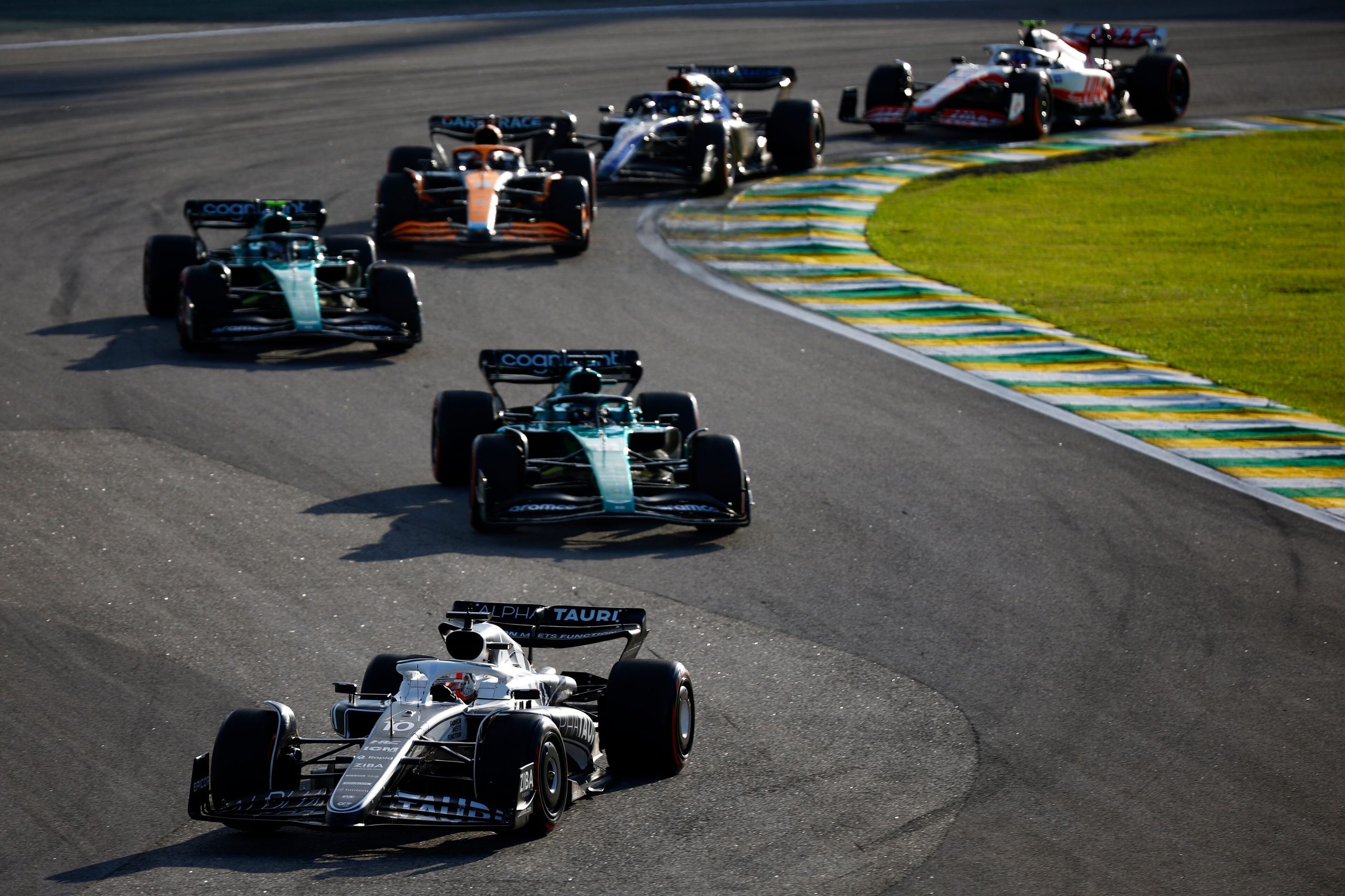 SAO PAULO, BRAZIL - NOVEMBER 12: Pierre Gasly of France driving the (10) Scuderia AlphaTauri AT03 leads Lance Stroll of Canada driving the (18) Aston Martin AMR22 Mercedes during the Sprint ahead of the F1 Grand Prix of Brazil at Autodromo Jose Carlos Pace on November 12, 2022 in Sao Paulo, Brazil. (Photo by Jared C. Tilton/Getty Images) // Getty Images / Red Bull Content Pool // SI202211120950 // Usage for editorial use only //