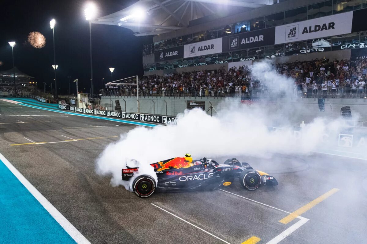ABU DHABI, UNITED ARAB EMIRATES - NOVEMBER 20: Third placed Sergio Perez of Mexico and Oracle Red Bull Racing performs a celebratory donut during the F1 Grand Prix of Abu Dhabi at Yas Marina Circuit on November 20, 2022 in Abu Dhabi, United Arab Emirates. (Photo by Rudy Carezzevoli/Getty Images) // Getty Images / Red Bull Content Pool // SI202211202860 // Usage for editorial use only //