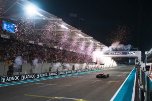 ABU DHABI, UNITED ARAB EMIRATES - NOVEMBER 20: Race winner Max Verstappen of the Netherlands driving the (1) Oracle Red Bull Racing RB18 crosses the finish line as fireworks are seen during the F1 Grand Prix of Abu Dhabi at Yas Marina Circuit on November 20, 2022 in Abu Dhabi, United Arab Emirates. (Photo by Rudy Carezzevoli/Getty Images) // Getty Images / Red Bull Content Pool // SI202211202866 // Usage for editorial use only //