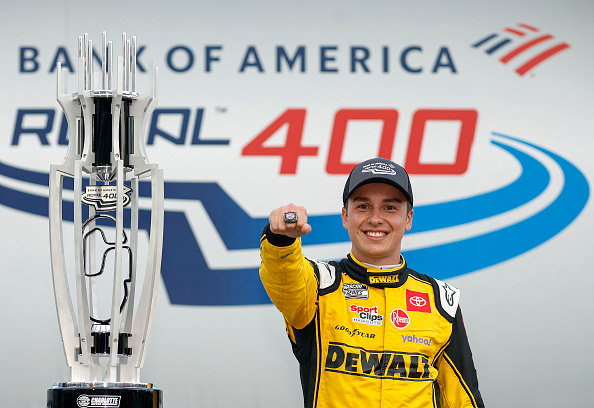 CONCORD, NORTH CAROLINA - OCTOBER 09: Christopher Bell, driver of the #20 DeWalt Toyota, displays his Bank of America Roval 400 at Charlotte Motor Speedway ring in victory lane after winning the NASCAR Cup Series Bank of America Roval 400 at Charlotte Motor Speedway on October 09, 2022 in Concord, North Carolina. (Photo by Jared C. Tilton/Getty Images)