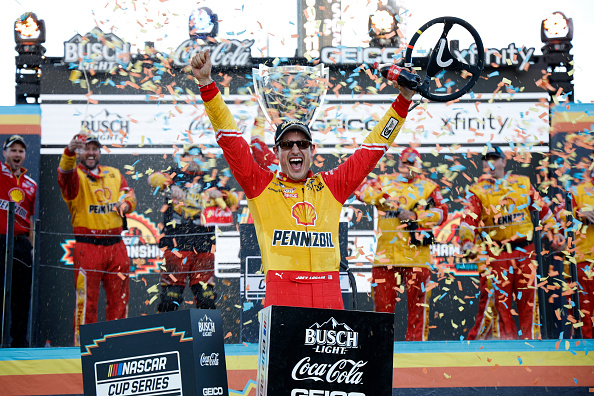 AVONDALE, ARIZONA - NOVEMBER 06: Joey Logano, driver of the #22 Shell Pennzoil Ford, celebrates in victory lane after winning the 2022 NASCAR Cup Series Championship at Phoenix Raceway on November 06, 2022 in Avondale, Arizona. (Photo by Chris Graythen/Getty Images)