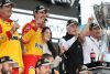 AVONDALE, ARIZONA - NOVEMBER 06: Joey Logano, driver of the #22 Shell Pennzoil Ford, celebrates with his wife, Brittany son, Hudson, team owner Roger Penske and crew in victory lane after winning the 2022 NASCAR Cup Series Championship at Phoenix Raceway on November 06, 2022 in Avondale, Arizona. (Photo by Meg Oliphant/Getty Images)