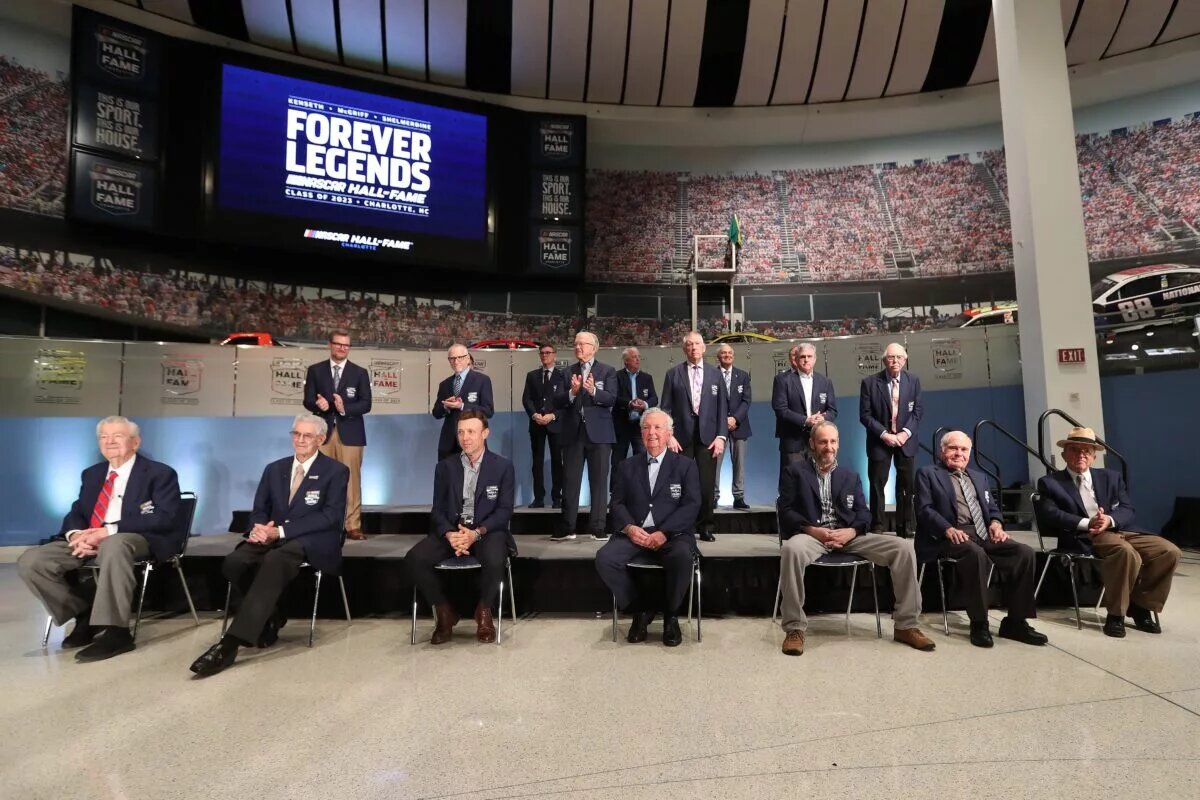 Credit: CHARLOTTE, NORTH CAROLINA - JANUARY 19: (L-R) NASCAR Hall of Famers (front-row) Bobby Allison, Leonard Wood, Matt Kenseth, Hershel McGriff, Kirk Shelmerdine, Jerry Cook, Jack Roush (back-row) Dale Earnhardt Jr., Mark Martin, Joe Gibbs, Bobby Labonte, Red Farmer, (back-row) Ray Evernham, Dale Jarrett and Ron Hornaday Jr. pose for photos during the Blue Jacket Ceremony at NASCAR Hall of Fame on January 19, 2023 in Charlotte, North Carolina. (Photo by David Jensen/Getty Images)
