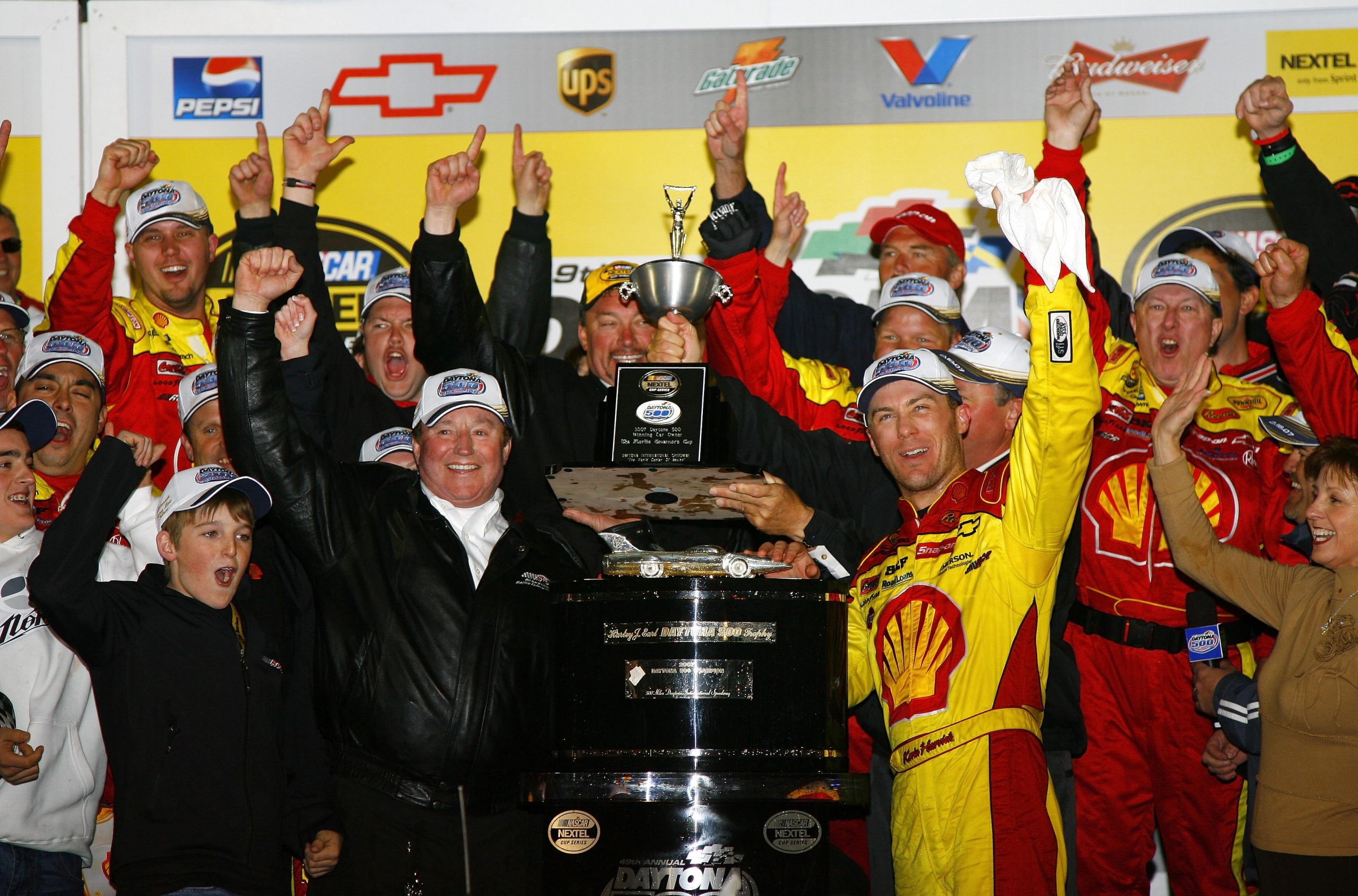 DAYTONA, FL - FEBRUARY 18: Kevin Harvick (R), driver of the #29 Shell/Pennzoil Chevrolet, and team owner Richard Childress, celebrate in victory lane with team members, after winning the NASCAR Nextel Cup Series Daytona 500 at Daytona International Speedway on February 18, 2007 in Daytona, Florida. (Photo by Rusty Jarrett/Getty Images for NASCAR)