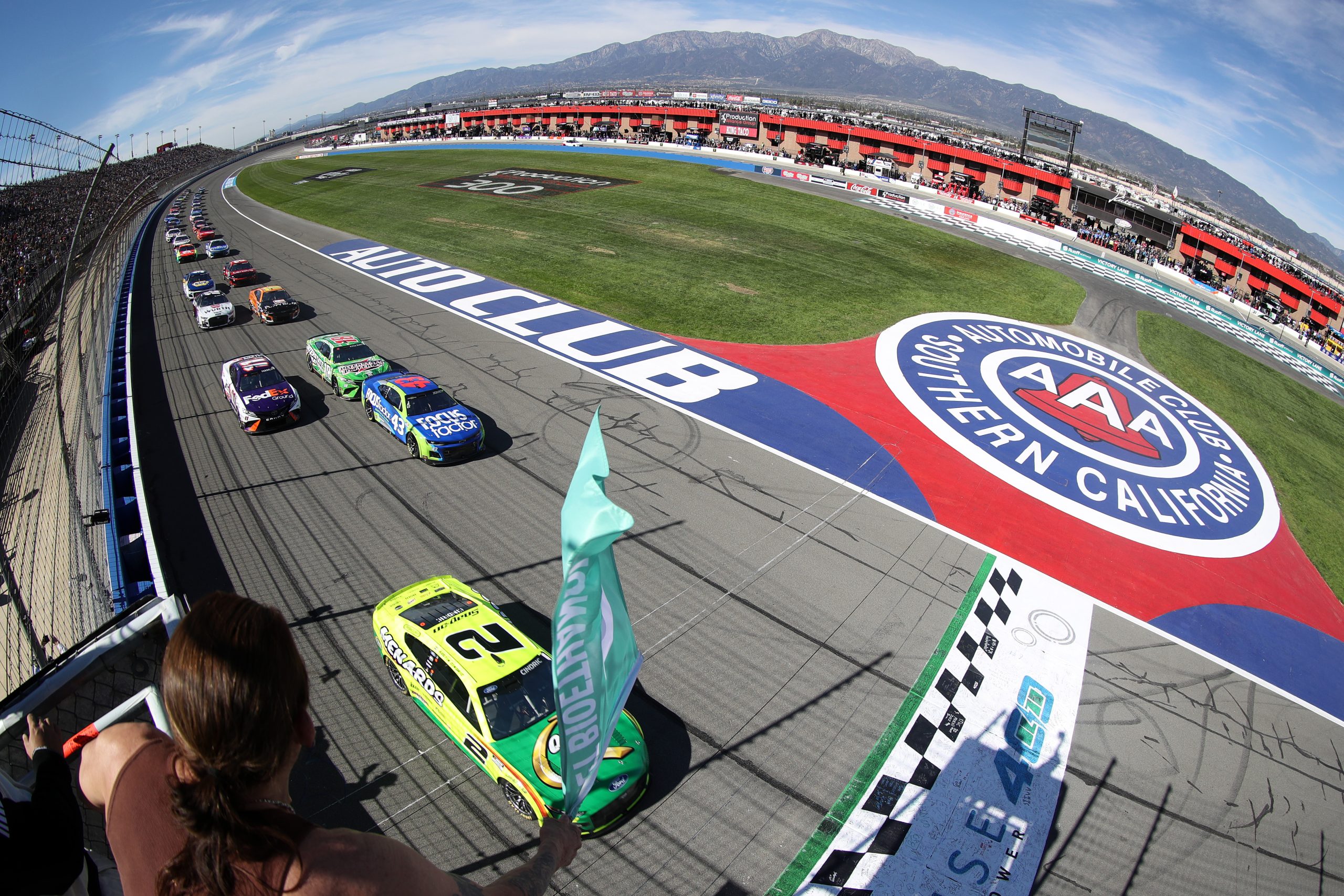 FONTANA, CALIFORNIA - FEBRUARY 27: Austin Cindric, driver of the #2 Menards/Quaker State Ford, leads the field to the green flag to start the NASCAR Cup Series Wise Power 400 at Auto Club Speedway on February 27, 2022 in Fontana, California. (Photo by Meg Oliphant/Getty Images)