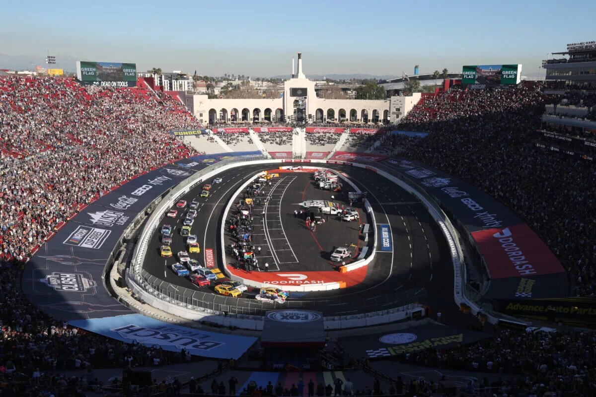 LOS ANGELES, CALIFORNIA - FEBRUARY 06: Kyle Busch, driver of the #18 M&M's Toyota, and Tyler Reddick, driver of the #8 Guaranteed Rate Chevrolet, lead the field during the NASCAR Cup Series Busch Light Clash at the Los Angeles Memorial Coliseum on February 06, 2022 in Los Angeles, California. (Photo by Meg Oliphant/Getty Images)