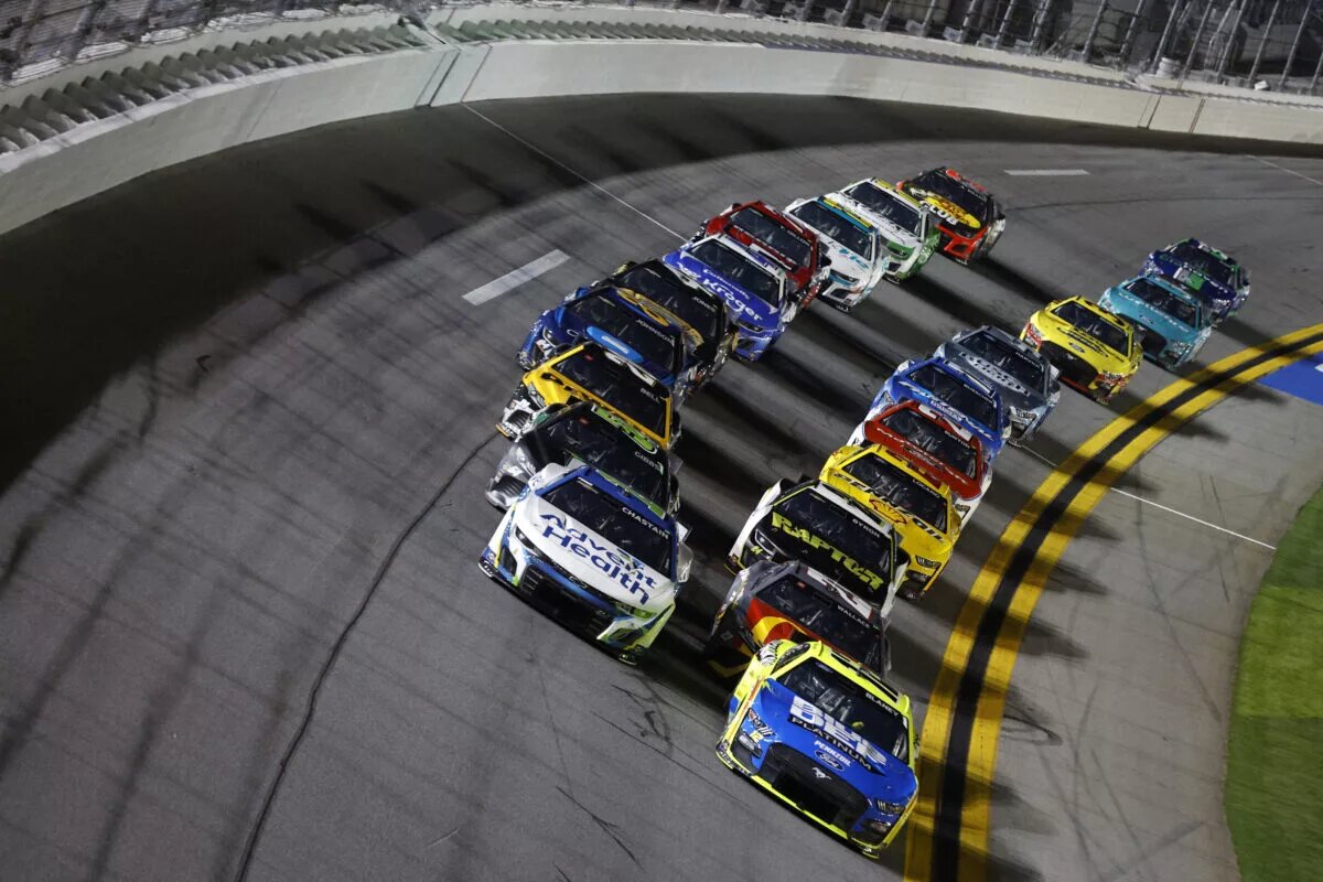 DAYTONA BEACH, FLORIDA - FEBRUARY 16: Ryan Blaney, driver of the #12 Menards/Blue DEF/PEAK Ford, and Ross Chastain, driver of the #1 AdventHealth Chevrolet, lead the field during the NASCAR Cup Series Bluegreen Vacations Duel #1 at Daytona International Speedway on February 16, 2023 in Daytona Beach, Florida. (Photo by Sean Gardner/Getty Images)