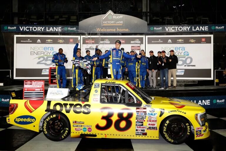 DAYTONA BEACH, FLORIDA - FEBRUARY 17: Zane Smith, driver of the #38 Love's/Speedco Ford, celebrates in victory lane after winning the rain-delayed NASCAR Craftsman Truck Series NextEra Energy 250 at Daytona International Speedway on February 17, 2023 in Daytona Beach, Florida. (Photo by Chris Graythen/Getty Images)