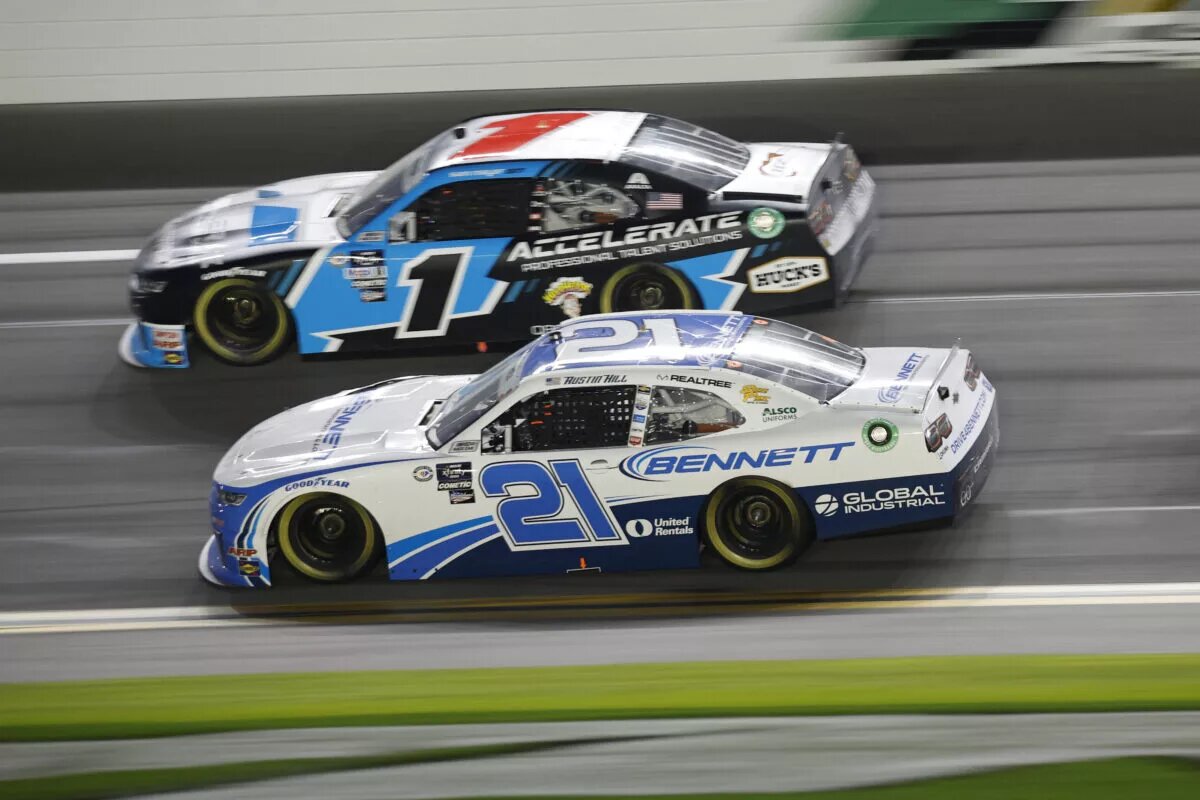 DAYTONA BEACH, FLORIDA - FEBRUARY 18: Austin Hill, driver of the #21 Bennett Transportation Chevrolet, and Sam Mayer, driver of the #1 Accelerate Pros Talent Chevrolet, race during the NASCAR Xfinity Series Beef. It's What's For Dinner. 300 at Daytona International Speedway on February 18, 2023 in Daytona Beach, Florida. (Photo by Chris Graythen/Getty Images)