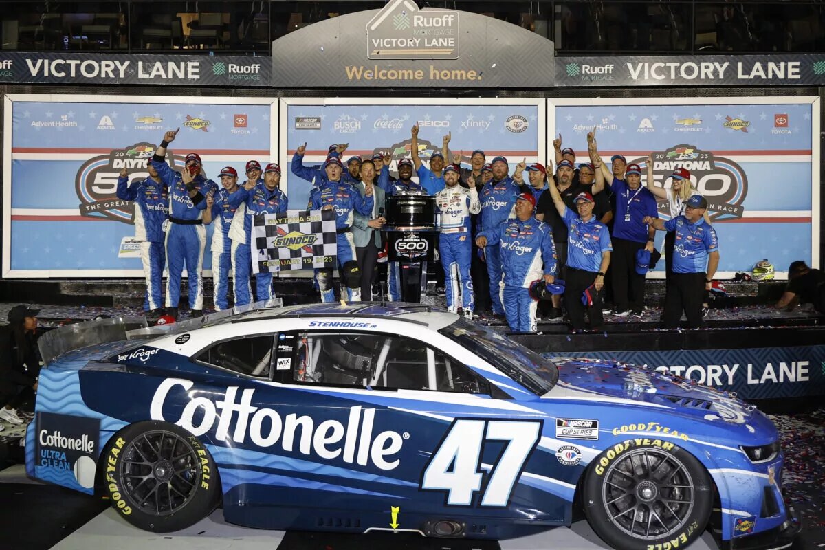 DAYTONA BEACH, FLORIDA - FEBRUARY 19: Ricky Stenhouse Jr., driver of the #47 Kroger/Cottonelle Chevrolet, and crew celebrate in victory lane after winning the NASCAR Cup Series 65th Annual Daytona 500 at Daytona International Speedway on February 19, 2023 in Daytona Beach, Florida. (Photo by Chris Graythen/Getty Images)