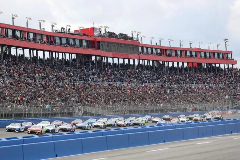 FONTANA, CALIFORNIA - FEBRUARY 26: Christopher Bell, driver of the #20 Sirius XM Toyota, and Ricky Stenhouse Jr, driver of the #47 Ralphs/Tree Top Chevrolet, lead the field to start the NASCAR Cup Series Pala Casino 400 at Auto Club Speedway on February 26, 2023 in Fontana, California. (Photo by Meg Oliphant/Getty Images)