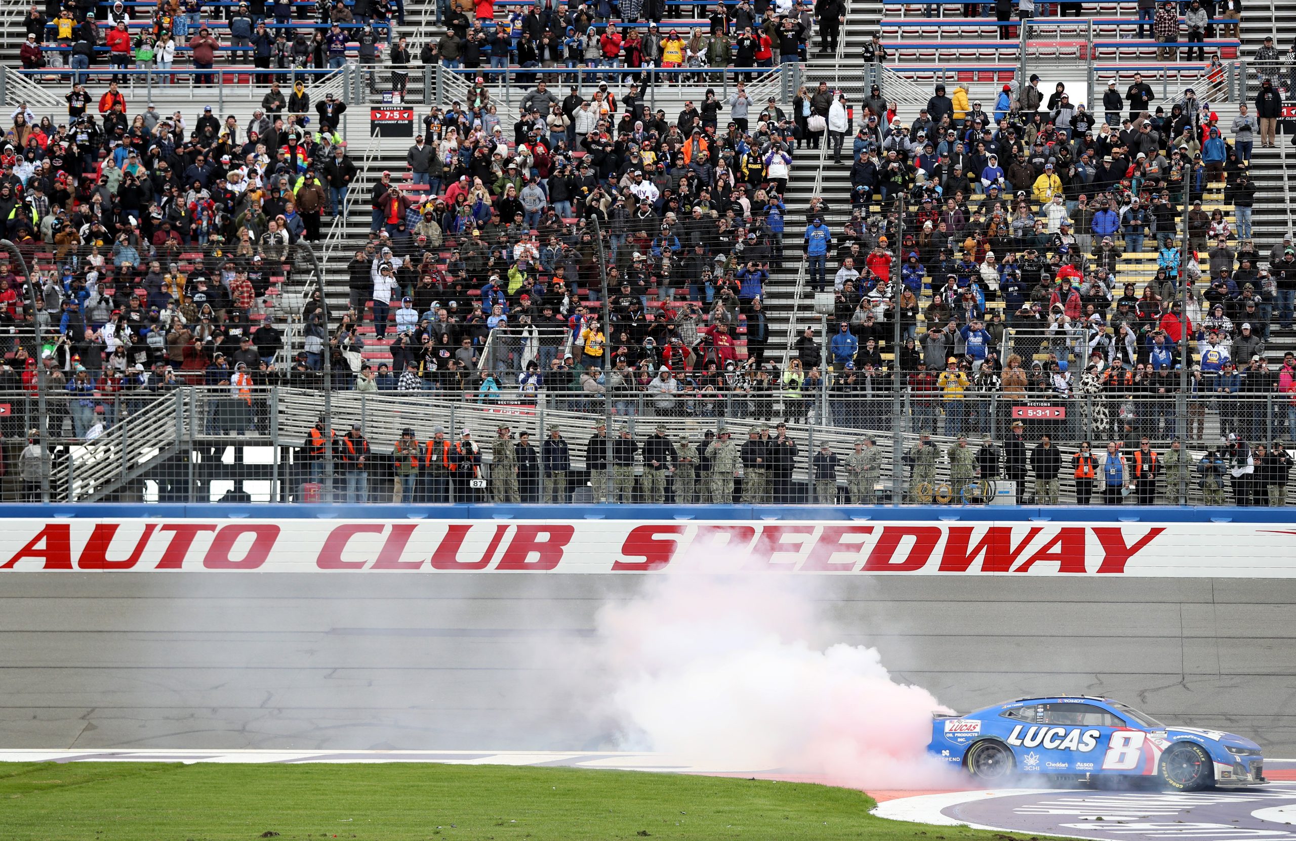 FONTANA, CALIFORNIA - FEBRUARY 26: Kyle Busch, driver of the #8 Lucas Oil Chevrolet, celebrates with a burnout after winning the NASCAR Cup Series Pala Casino 400 at Auto Club Speedway on February 26, 2023 in Fontana, California. (Photo by Meg Oliphant/Getty Images)