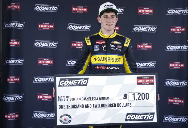 DAYTONA BEACH, FLORIDA - FEBRUARY 17: Nick Sanchez, driver of the #2 Gainbridge Chevrolet, poses with the pole award winner $1,200.00 check during qualifying for the NASCAR Craftsman Truck Series NextEra Energy 250 at Daytona International Speedway on February 17, 2023 in Daytona Beach, Florida. (Photo by Sean Gardner/Getty Images)