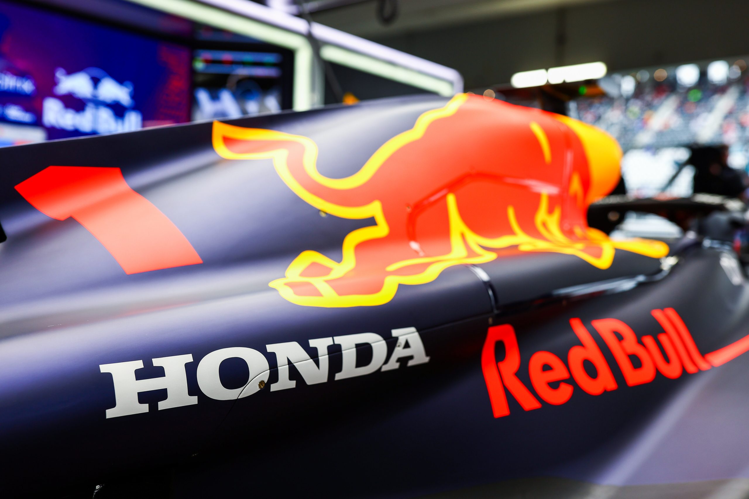 SUZUKA, JAPAN - OCTOBER 07: Honda branding is pictured on the car of Max Verstappen of the Netherlands and Oracle Red Bull Racing in the garage during practice ahead of the F1 Grand Prix of Japan at Suzuka International Racing Course on October 07, 2022 in Suzuka, Japan. (Photo by Mark Thompson/Getty Images) // Getty Images / Red Bull Content Pool // SI202210070148 // Usage for editorial use only //