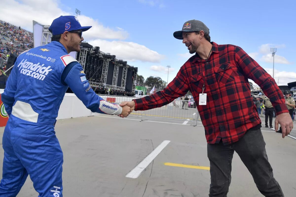 Returning for Daytona. MARTINSVILLE, Va. - OCTOBER 31: Travis Pastrana and Kyle Larson, driver of the #5 HendrickCars.com Chevrolet, shake hands on the grid prior to the NASCAR Cup Series Xfinity 500 at Martinsville Speedway on Oct. 31, 2021, in Martinsville, Virginia. Photo: Logan Riely/Getty Images