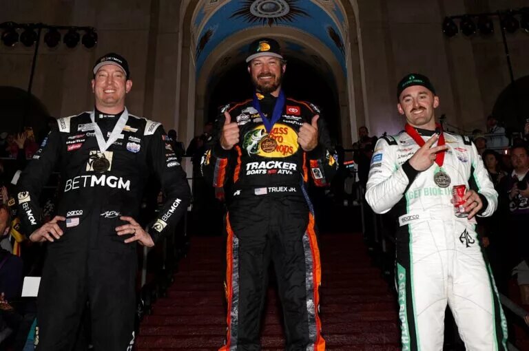 Credit: LOS ANGELES, CALIFORNIA - FEBRUARY 05: Martin Truex Jr., driver of the #19 Bass Pro Shops Toyota, (C) winner, Austin Dillon, driver of the #3 Get Bioethanol Chevrolet, (L) second place and Kyle Busch, driver of the #8 BetMGM Chevrolet, third place pose for photos on the podium after the NASCAR Clash at the Coliseum at Los Angeles Memorial Coliseum on February 05, 2023 in Los Angeles, California. (Photo by Chris Graythen/Getty Images)