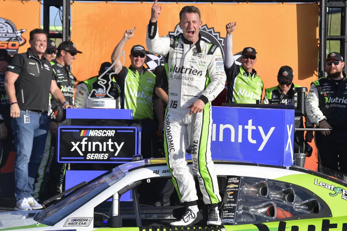 AUSTIN, TEXAS - MARCH 26: AJ Allmendinger, driver of the #16 Nutrien Ag Solutions Chevrolet, celebrates in victory lane after winning the NASCAR Xfinity Series Pit Boss 250 at Circuit of The Americas on March 26, 2022 in Austin, Texas. (Photo by Logan Riely/Getty Images)