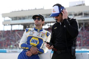 AVONDALE, ARIZONA - NOVEMBER 05: Chase Elliott, driver of the #9 NAPA Auto Parts Chevrolet, and crew chief Alan Gustafson meet on the grid during qualifying for the NASCAR Cup Series Championship at Phoenix Raceway on November 05, 2022 in Avondale, Arizona. (Photo by Meg Oliphant/Getty Images)