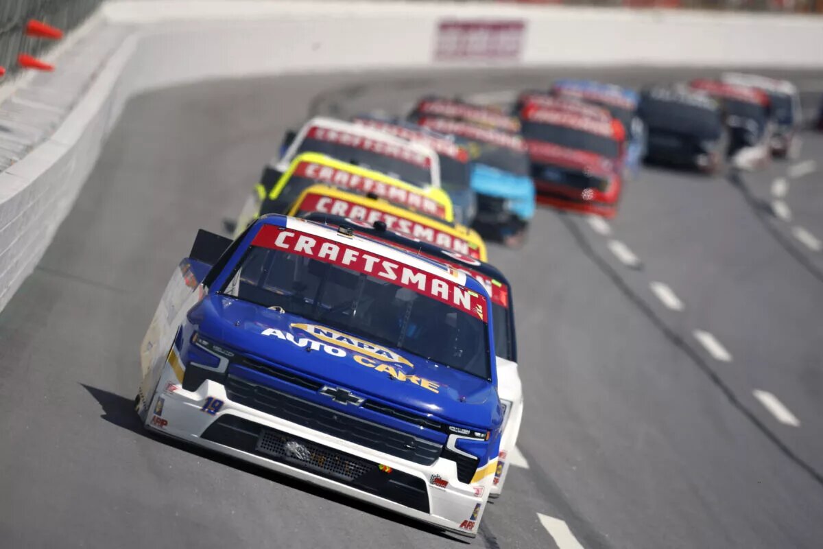 HAMPTON, GEORGIA - MARCH 18: Christian Eckes, driver of the #19 NAPA AutoCare Chevrolet, leads the field during the NASCAR Craftsman Truck Series Fr8 208 at Atlanta Motor Speedway on March 18, 2023 in Hampton, Georgia. (Photo by Sean Gardner/Getty Images)