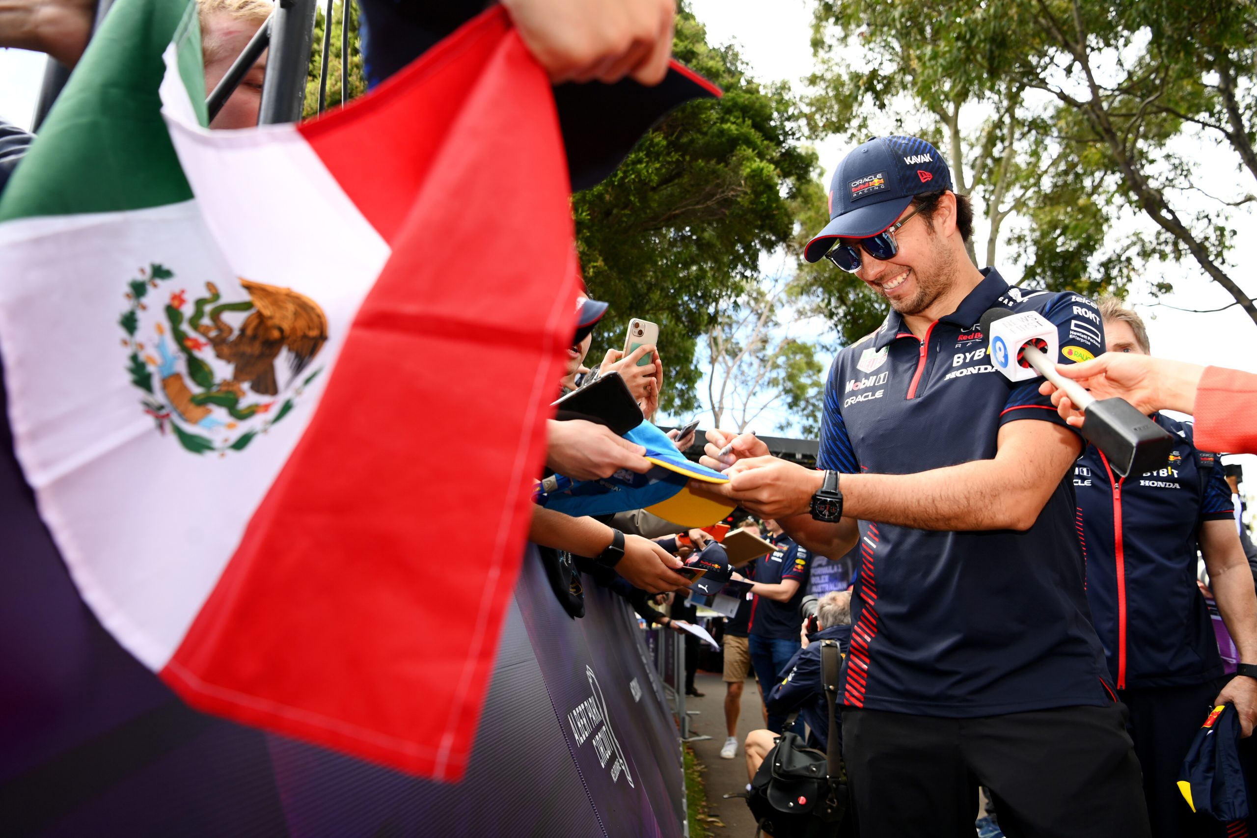 MELBOURNE, AUSTRALIA - MARCH 30: Sergio Perez of Mexico and Oracle Red Bull Racing greets fans on the Melbourne Walk during previews ahead of the F1 Grand Prix of Australia at Albert Park Grand Prix Circuit on March 30, 2023 in Melbourne, Australia. (Photo by Quinn Rooney/Getty Images) // Getty Images / Red Bull Content Pool // SI202303300098 // Usage for editorial use only //